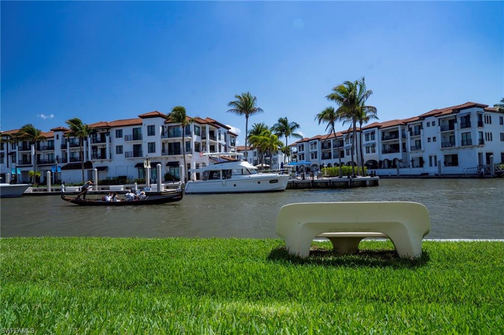 805 River Point Drive, Unit 103C Naples, FL 34102 - Photo 9 of 27 a view of a lake with houses