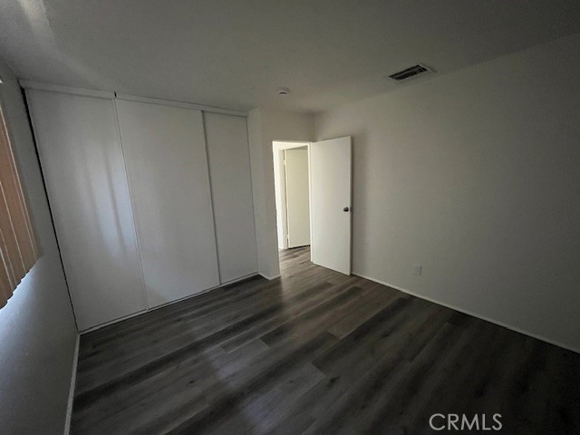 73740 Santa Rosa Way, Unit 5 Palm Desert, CA 92260 - Photo 17 of 20 a view of an empty room and wooden floor