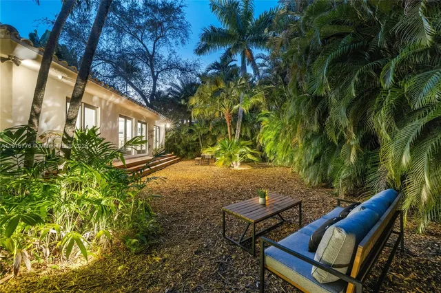 a spacious bedroom with a bed and a table