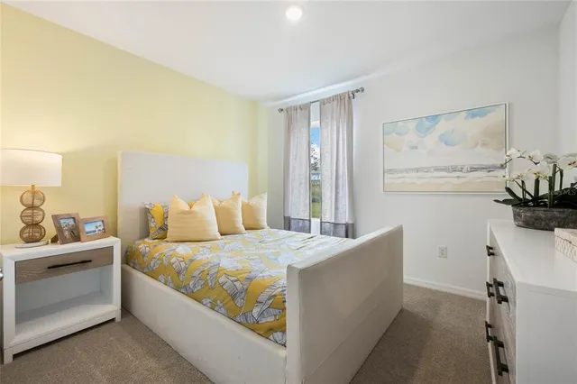 a bedroom with a bed and a cabinets