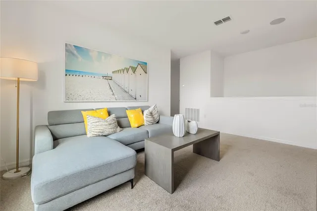 a living room with furniture and a couch