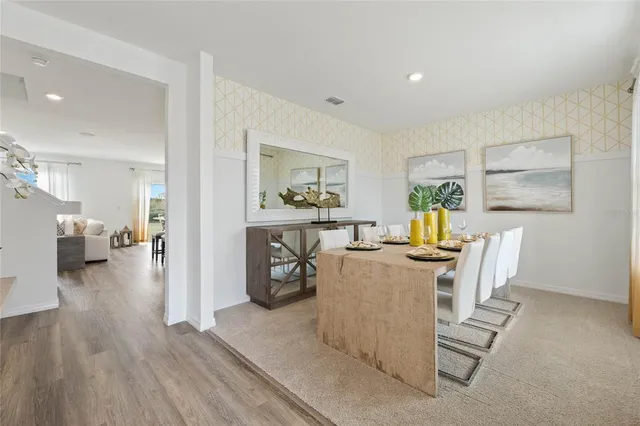 a living room with furniture and a table