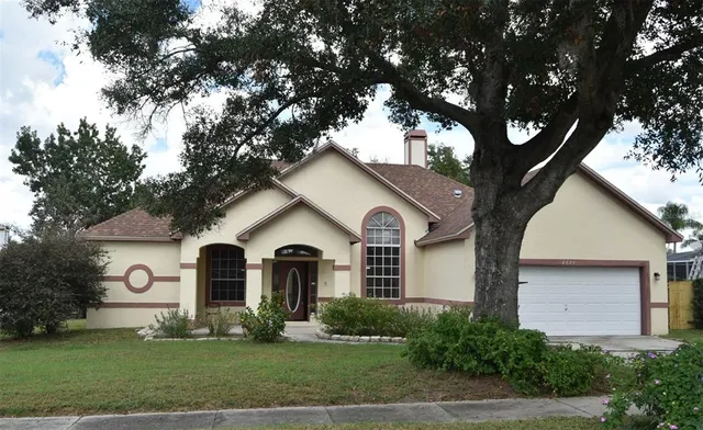 a view of house with garden