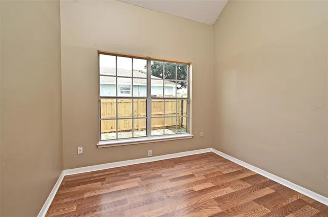 a bathroom with a sink a toilet and a large mirror
