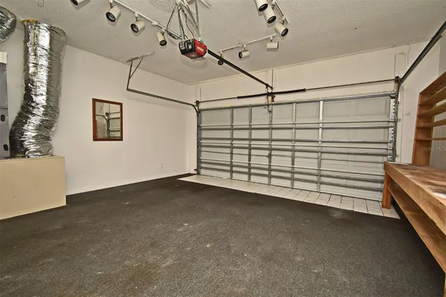 a view of backyard of house with green space