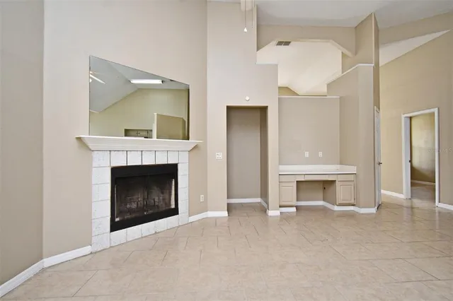 a view of a kitchen with a sink and dishwasher a refrigerator with white cabinets