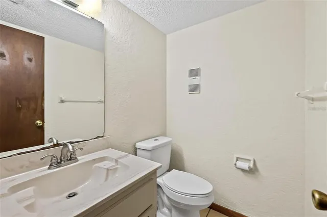 a view of an empty room and closet area