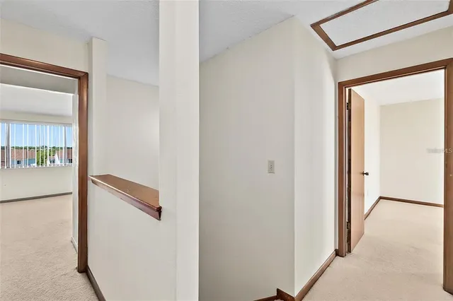 a view of an empty room with windows