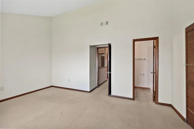a view of empty room with floor to ceiling window