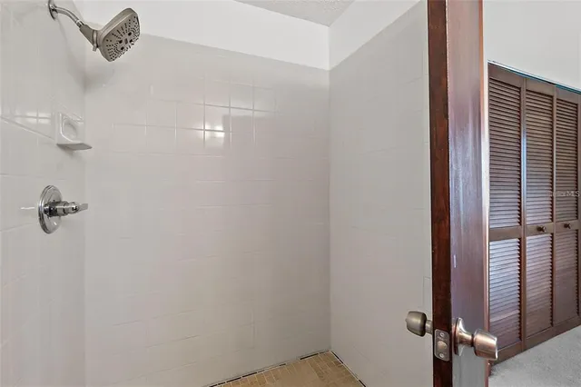 a aerial view of a house with a garden and lake view