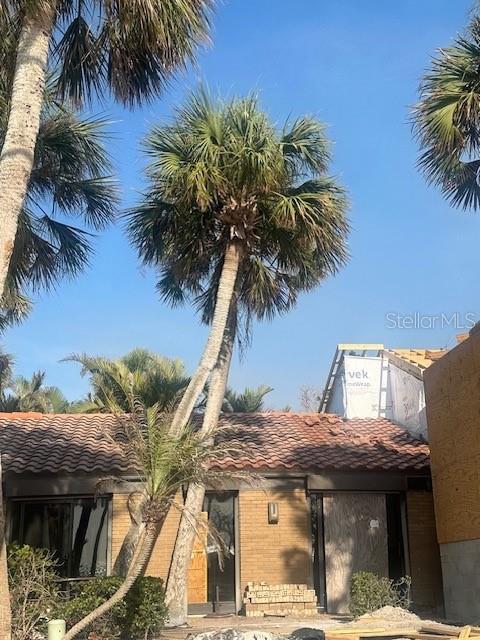 a view of multiple house with a tree