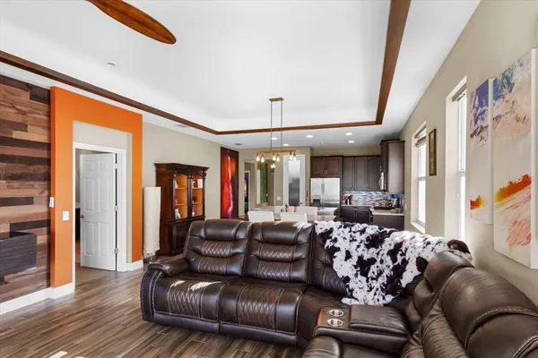 a view of a dining room with furniture and wooden floor