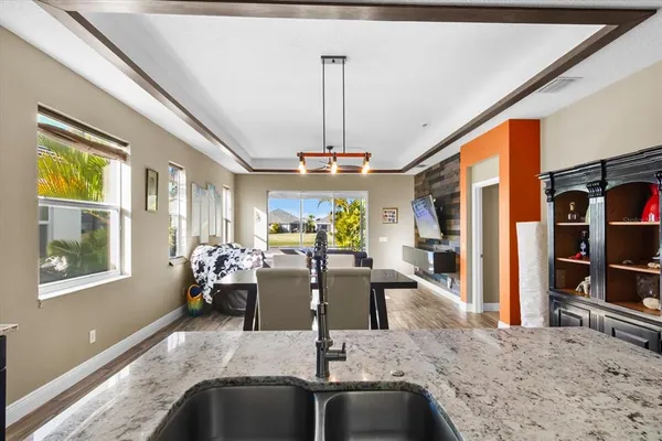 a kitchen with stainless steel appliances granite countertop a stove and cabinets