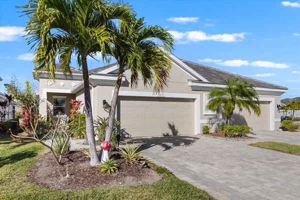 a view of a house with a small yard