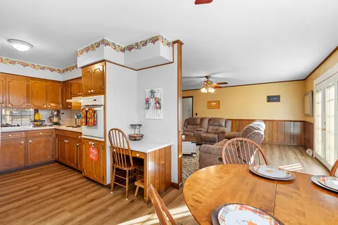 a kitchen with stainless steel appliances granite countertop a sink and cabinets