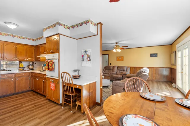 a kitchen with stainless steel appliances granite countertop a sink and cabinets