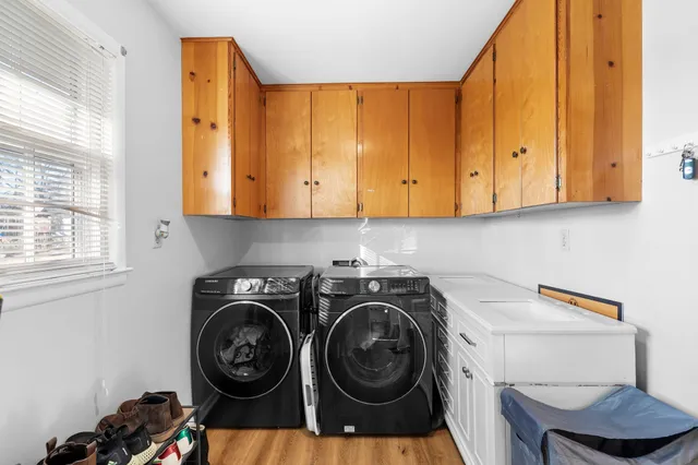 a view of a storage and utility room with washer and dryer