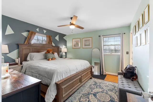 a bedroom with bed and window