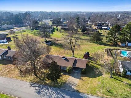 a view of a swimming pool with a lounge chairs