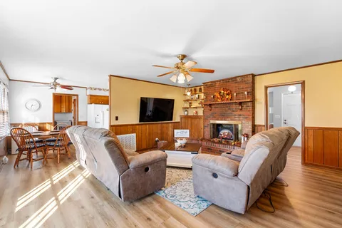 a living room with furniture fireplace and a flat screen tv