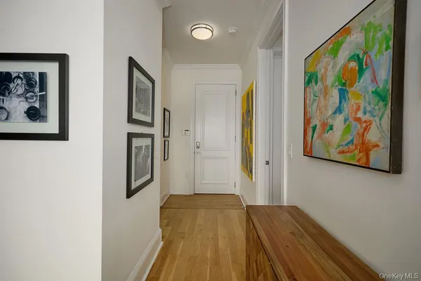 a view of front door with wooden floor