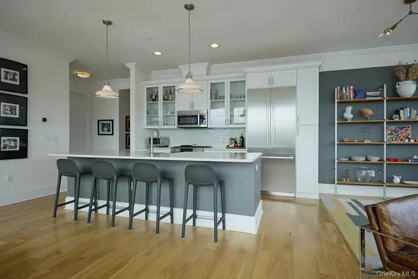 a large kitchen with lots of counter space and stainless steel appliances