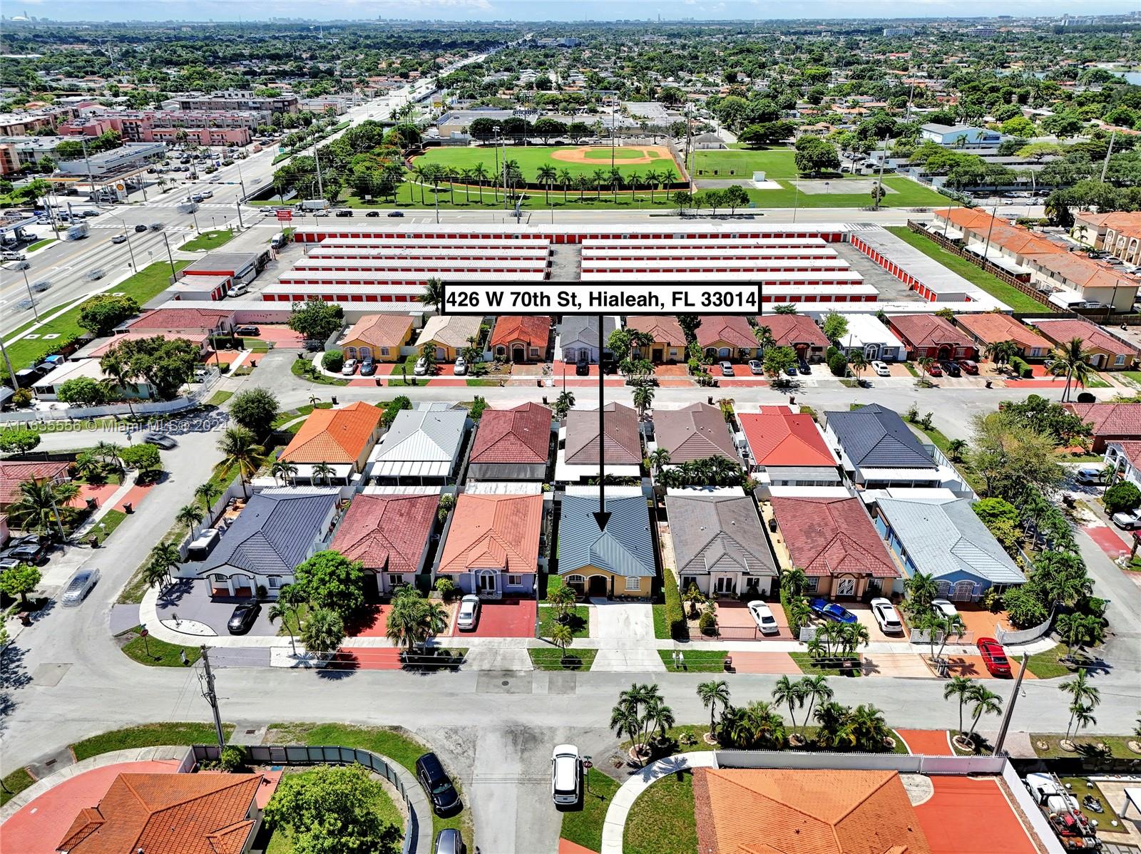 426 West 70th Street Hialeah, FL 33014 - Photo 3 of 26 an aerial view of residential houses with outdoor space
