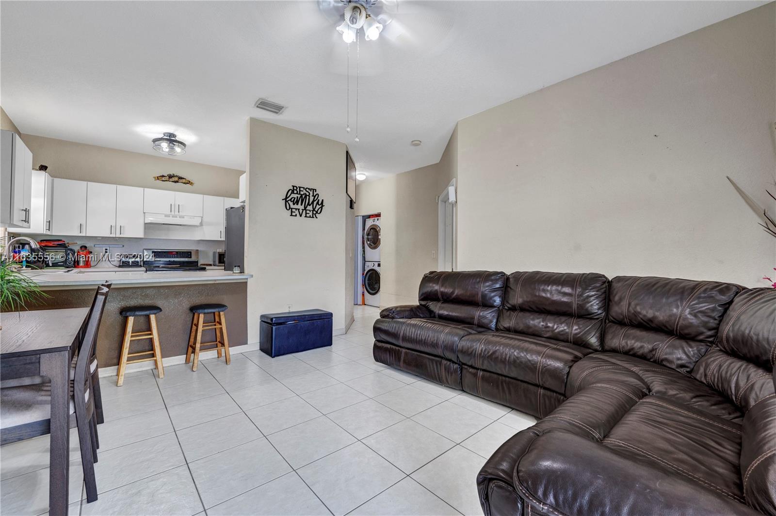 426 West 70th Street Hialeah, FL 33014 - Photo 6 of 26 a living room with furniture and a fireplace