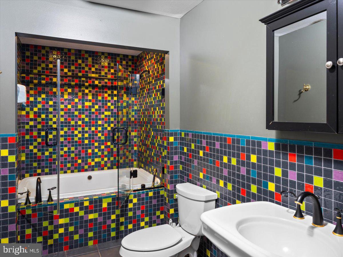 3533 State Rte 2012 Union Dale, PA 18470 - Photo 35 of 57 Colorful tiled bath with tub and vanity