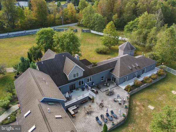a aerial view of a house with a garden and plants