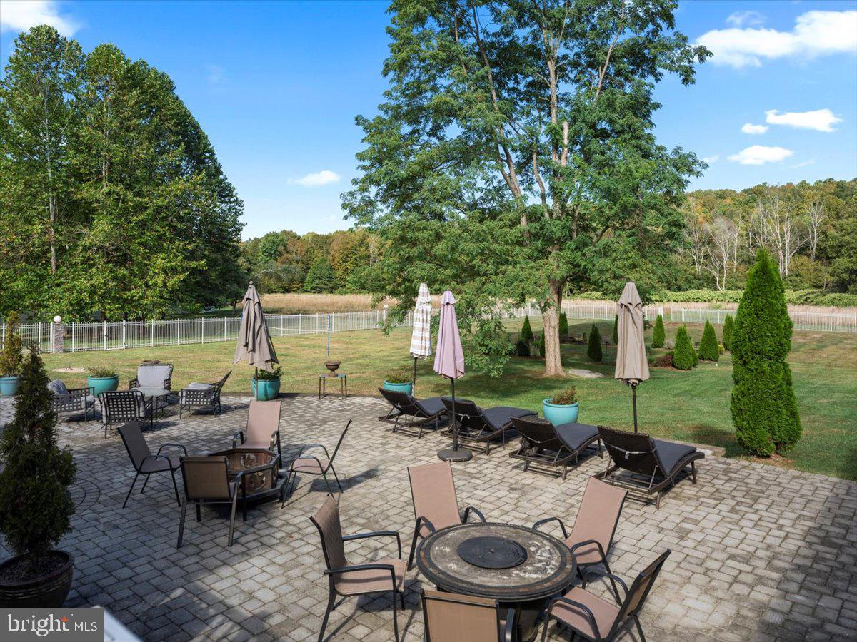 3533 State Rte 2012 Union Dale, PA 18470 - Photo 52 of 57 Paver terrace with dining, chaises and fire table