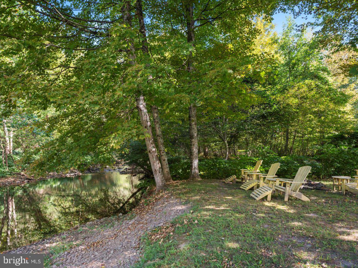3533 State Rte 2012 Union Dale, PA 18470 - Photo 55 of 57 Serene creekside seating area.