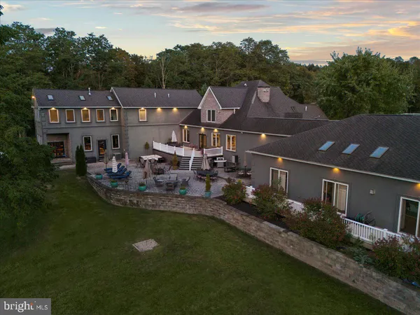 a aerial view of a house with a garden and plants