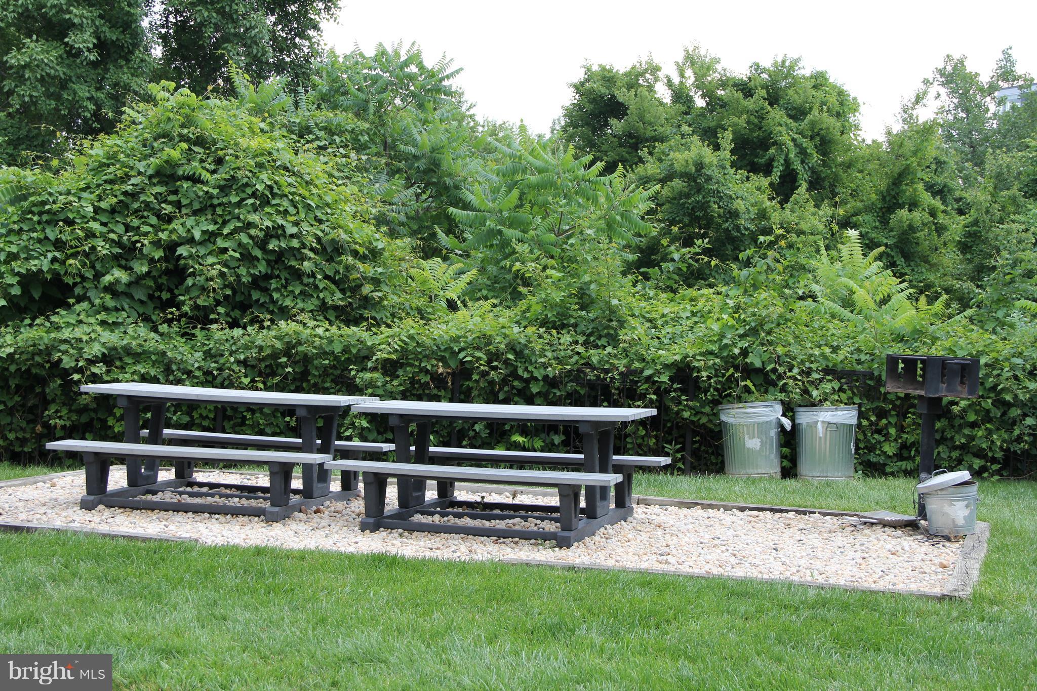 1580 Spring Gate Dr., Unit 4102 McLean, VA 22102 - Photo 16 of 26 a view of a bench in the garden