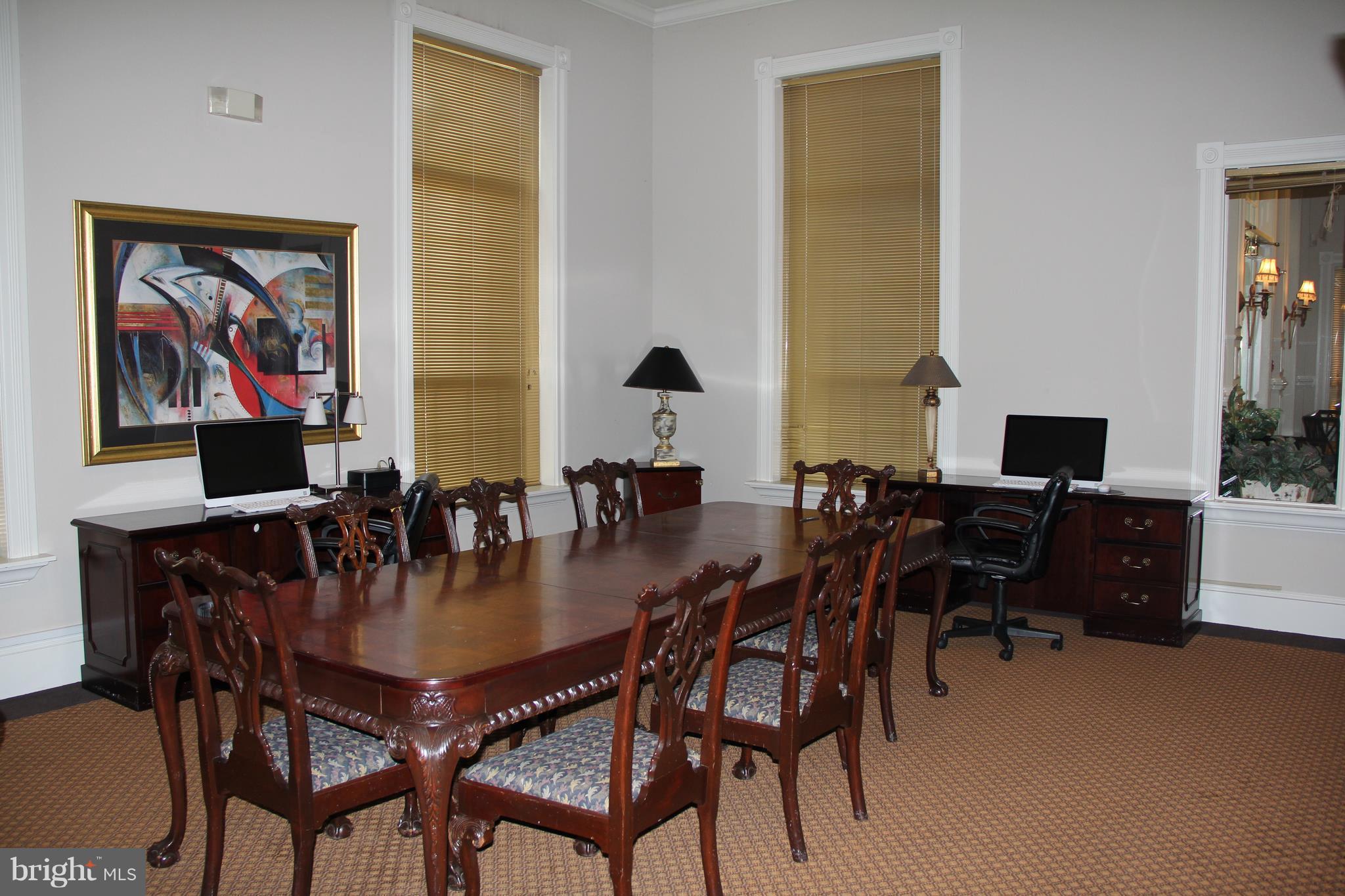 1580 Spring Gate Dr., Unit 4102 McLean, VA 22102 - Photo 21 of 26 a view of a dining room with furniture and chandelier