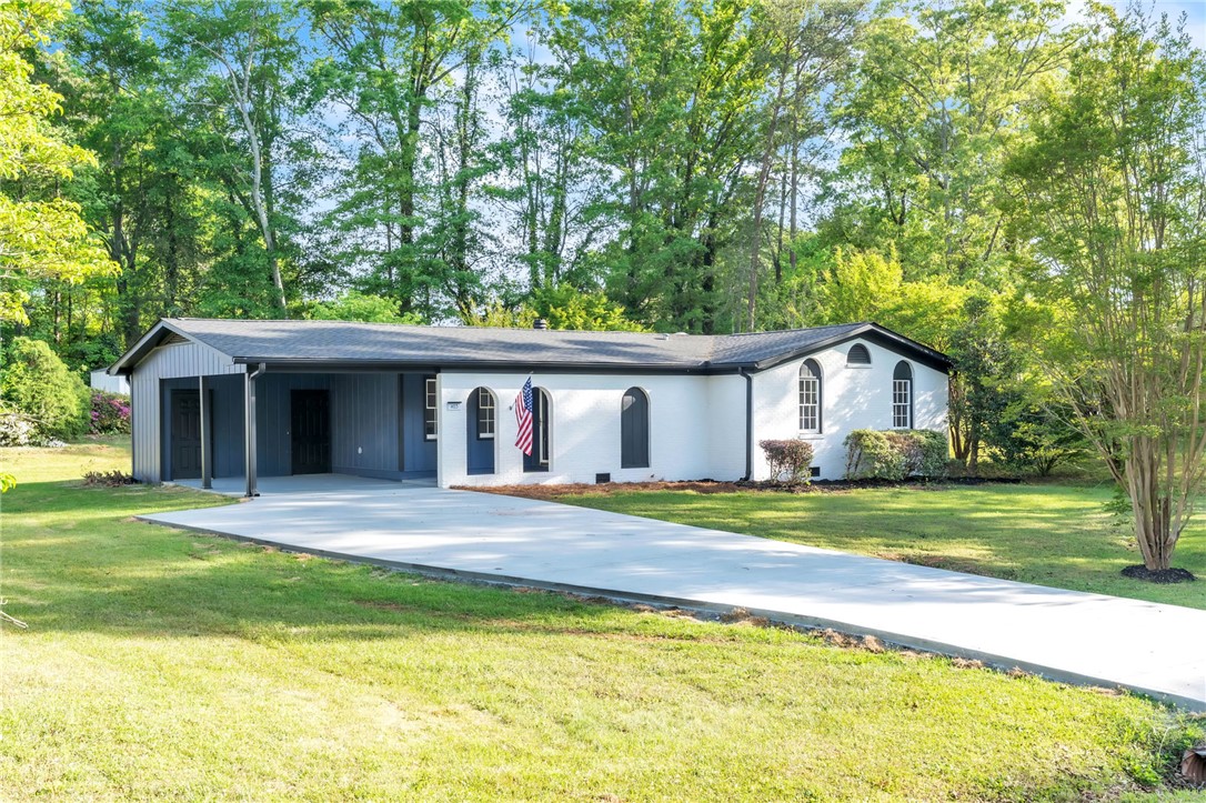 403 Keith Lane Seneca, SC 29678 - Photo 1 of 28 This ranch-style residence features a spacious driveway and mature landscaping, offering a serene outdoor setting.
