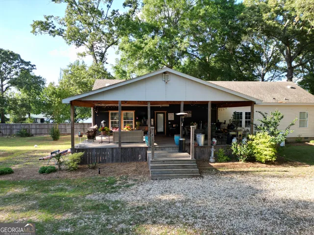 a view of a house with a tree