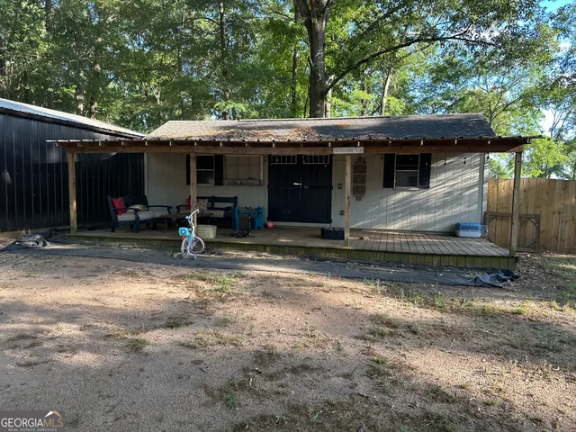 a kitchen with stainless steel appliances kitchen island granite countertop a sink counter space cabinets and a counter top space