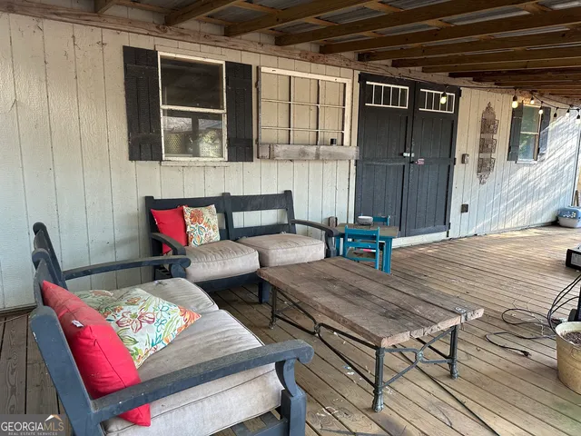 a kitchen with stainless steel appliances kitchen island granite countertop a sink a stove and cabinets