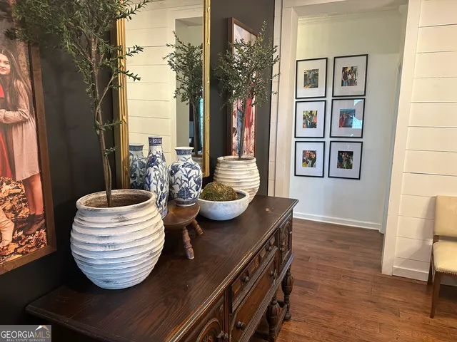a view of a dining room with furniture and wooden floor