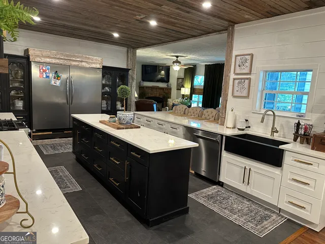 a kitchen with a refrigerator and countertop