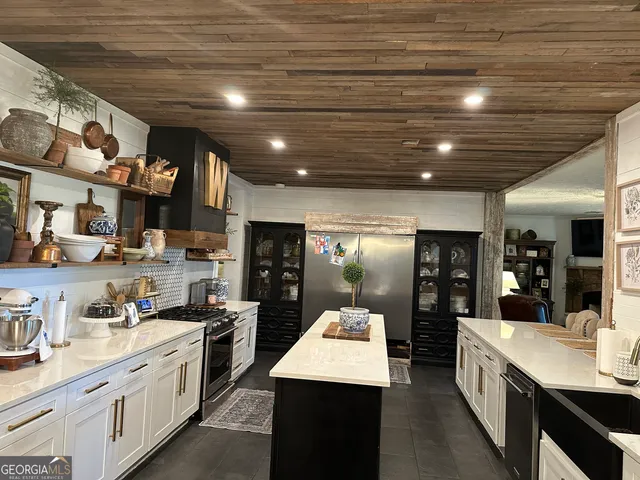 a kitchen with a stove and cabinets