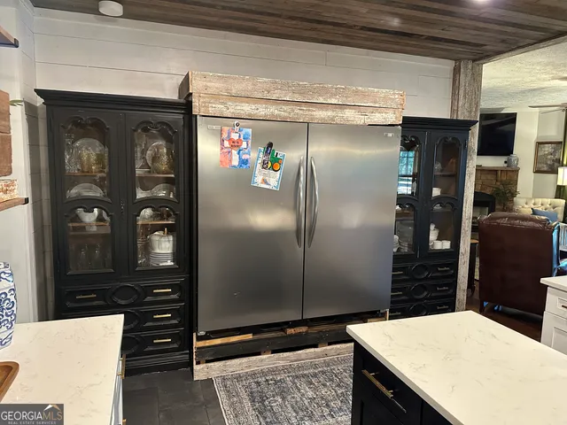 a kitchen with counter top space and cabinets