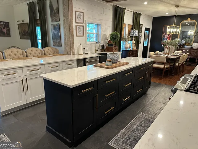 a kitchen with a sink a stove and a refrigerator