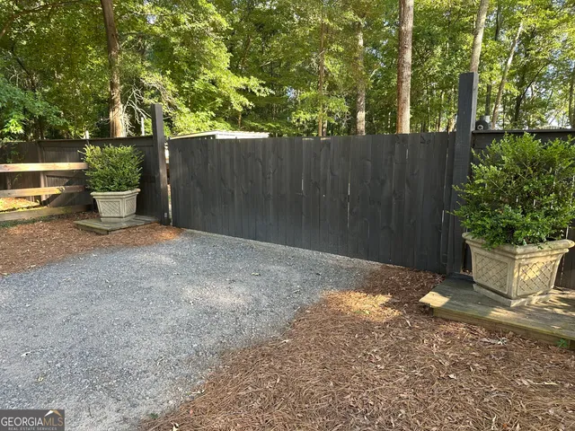 a view of a house with backyard porch and sitting area