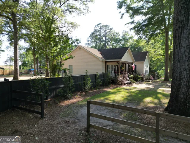 a house with a trees in front of it
