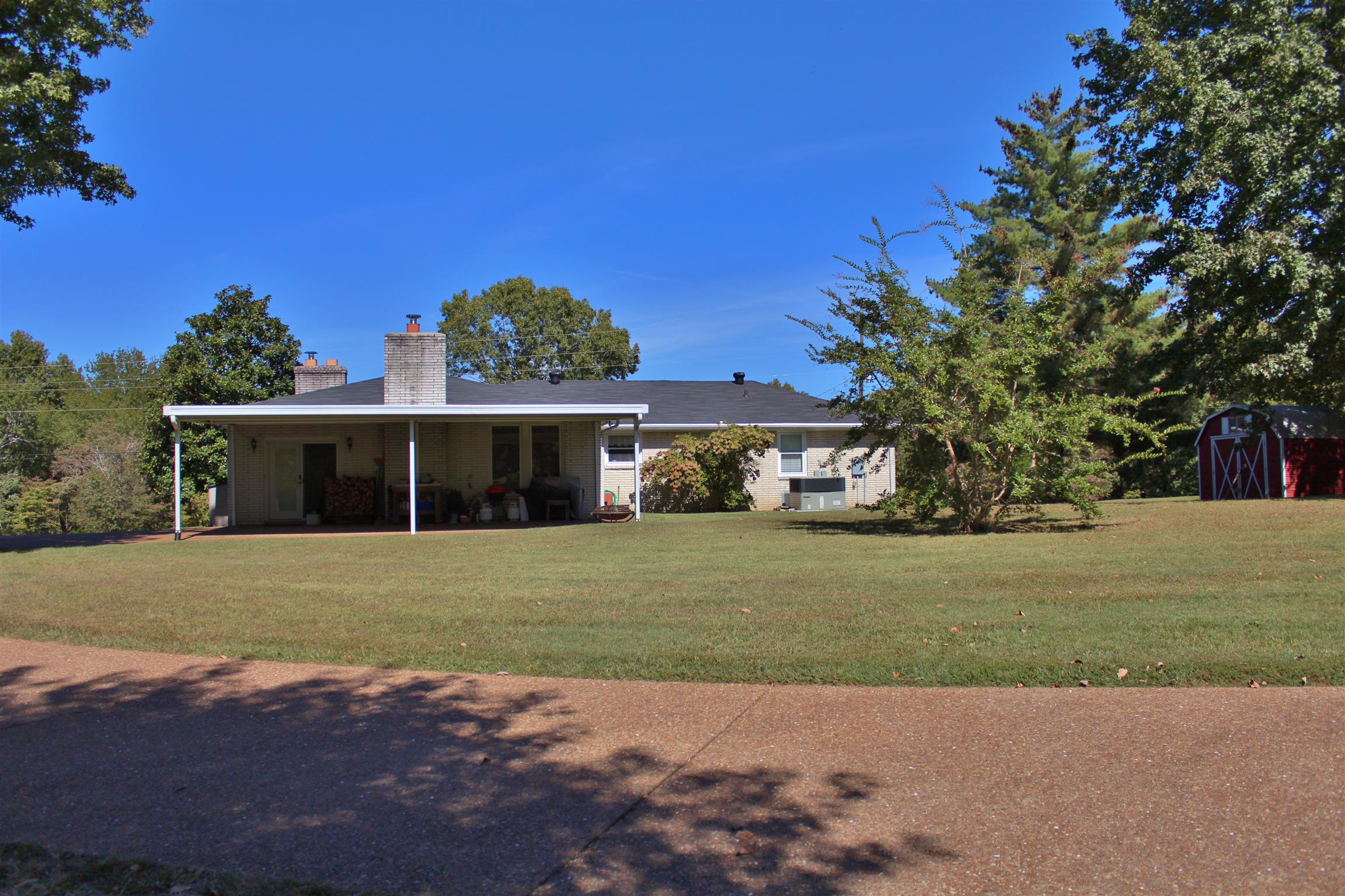 7506 King Road Fairview, TN 37062 - Photo 14 of 30 a front view of a house with a garden