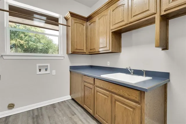 a kitchen with stainless steel appliances granite countertop a sink and cabinets