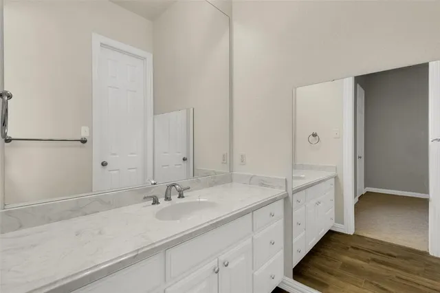 an empty room with a ceiling fan and a window