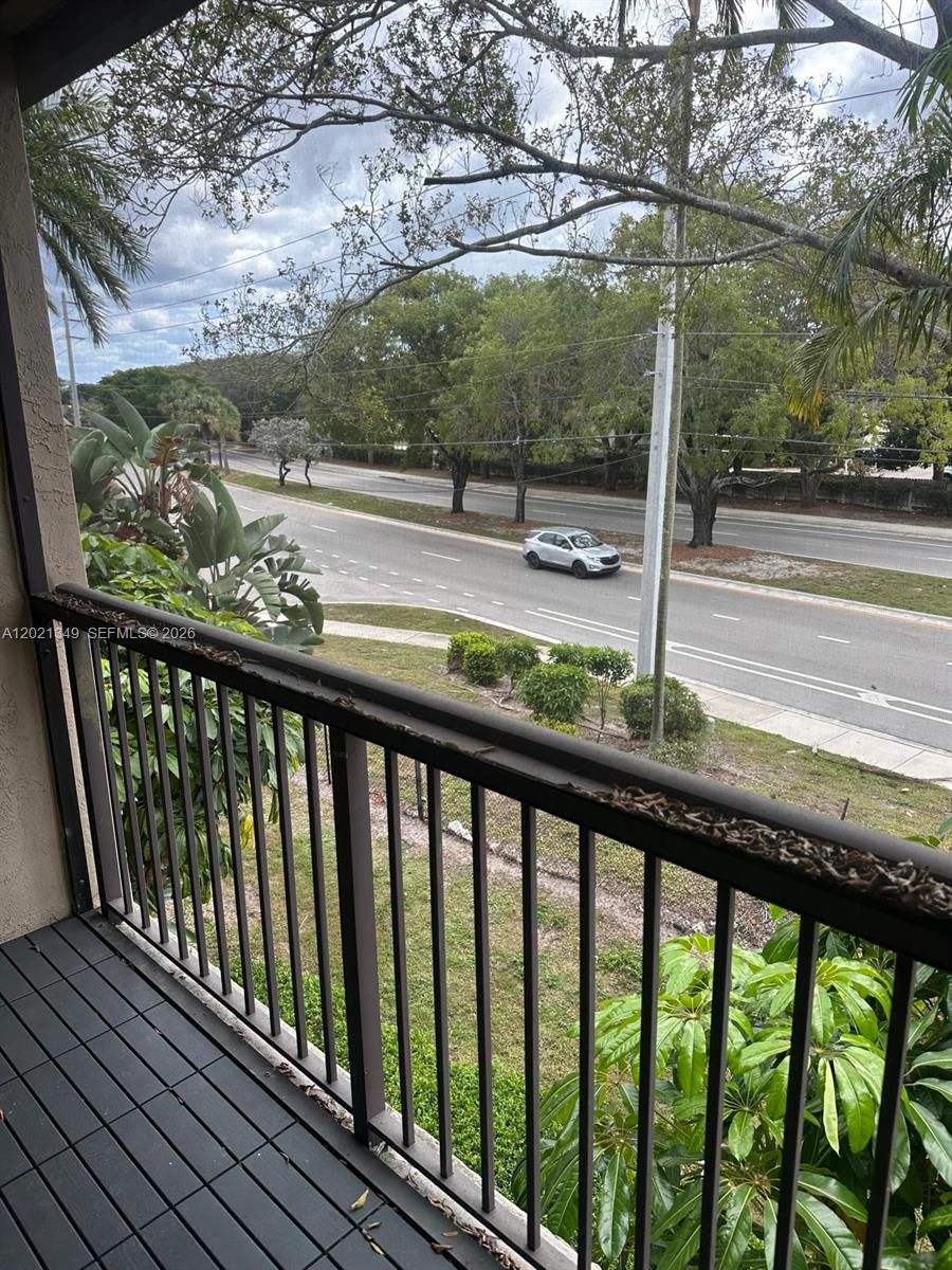 4481 West McNab Road, Unit 37 Pompano Beach, FL 33069 - Photo 6 of 20 a view of a wooden deck next to a yard